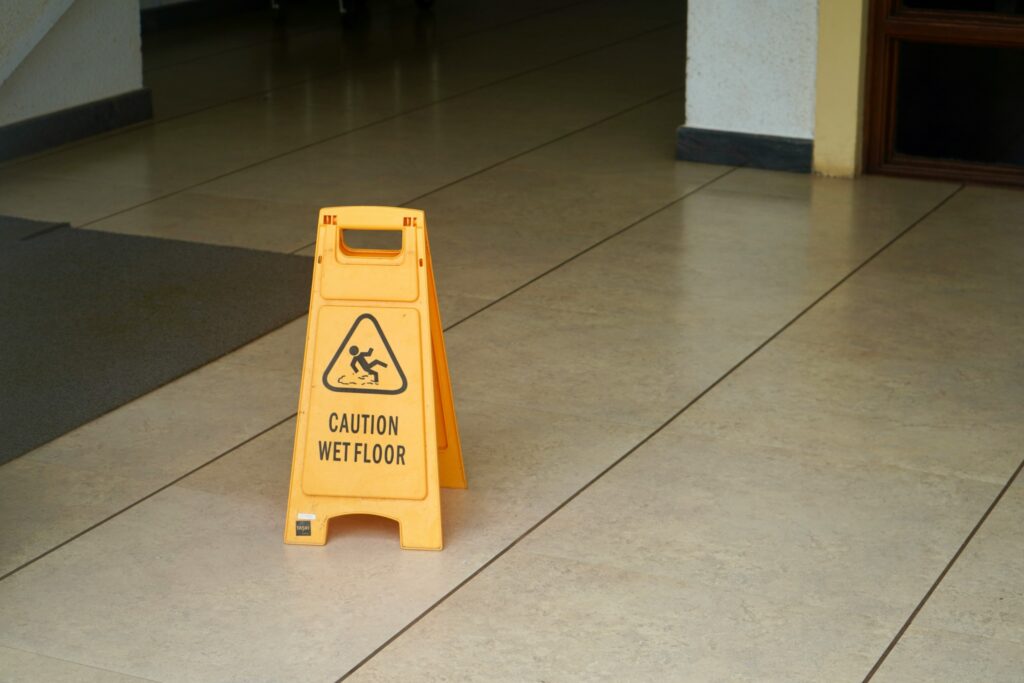 Wet floor sign from a leaky commercial roof