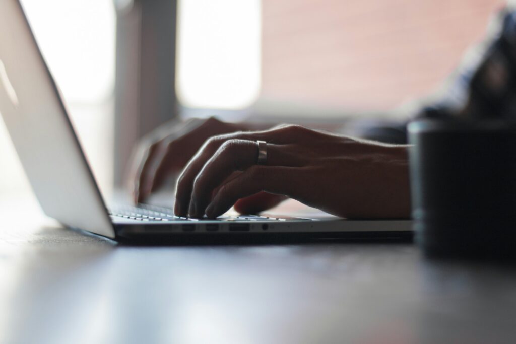 Reviewing roofing report on laptop