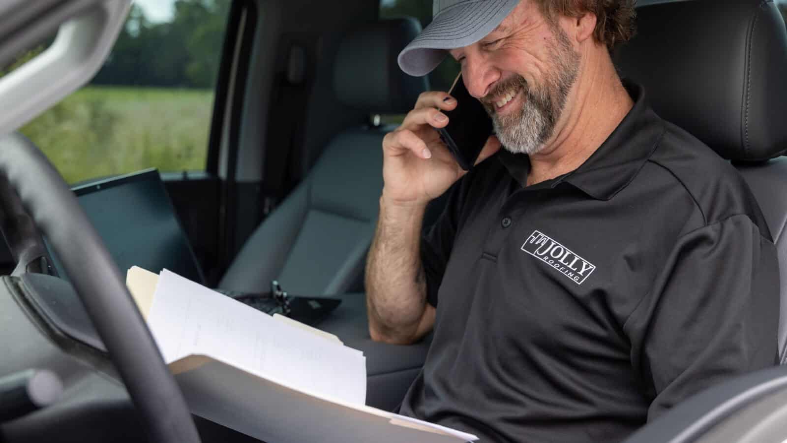 Commercial roofing company worker on the phone