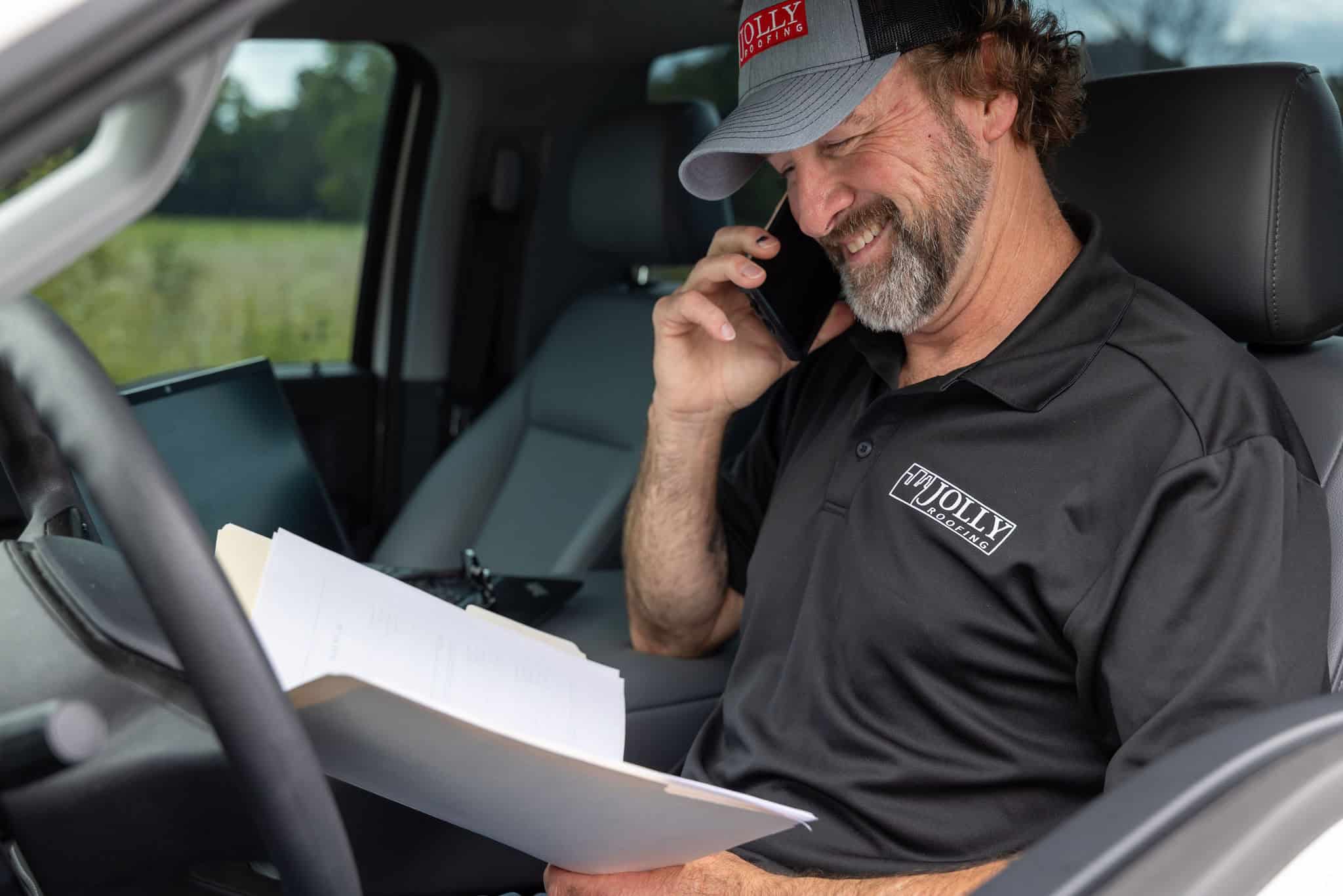 Commercial roofing company worker on the phone