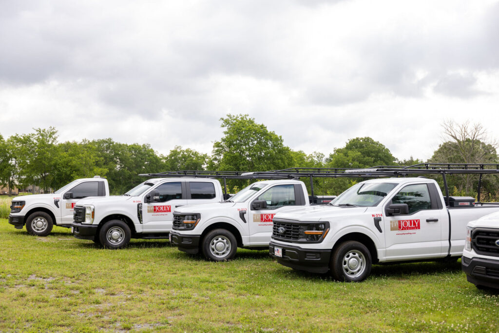 Jolly Roofing trucks