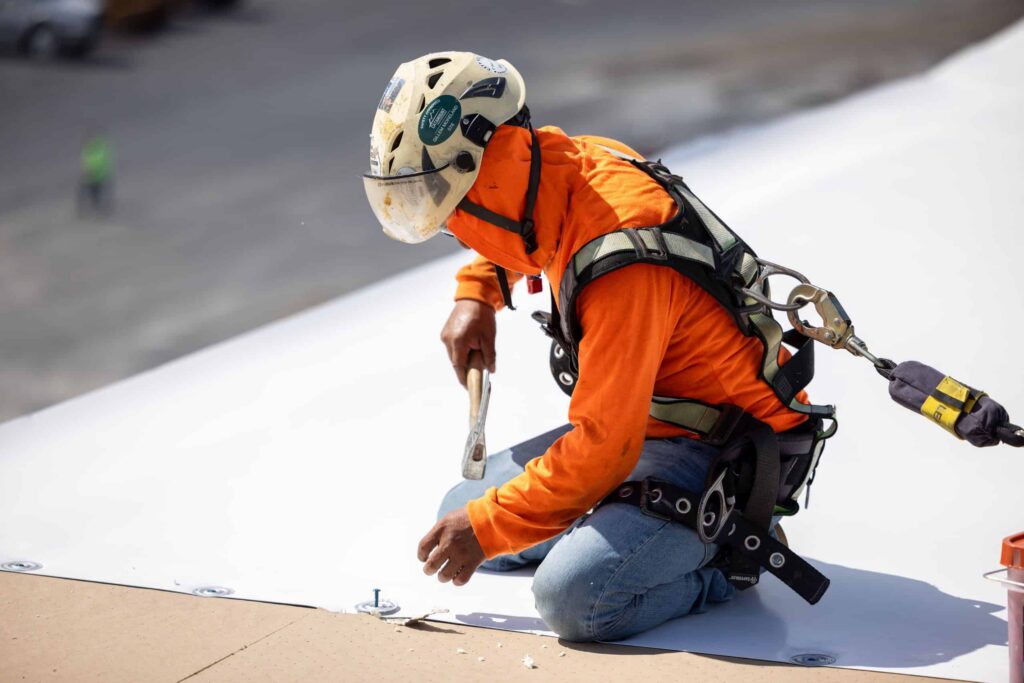 Commerical roofer with safety gear